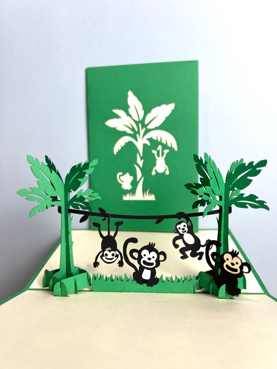 Popup card featuring playful monkeys in a fun pop-up jungle scene, suitable for any occasions