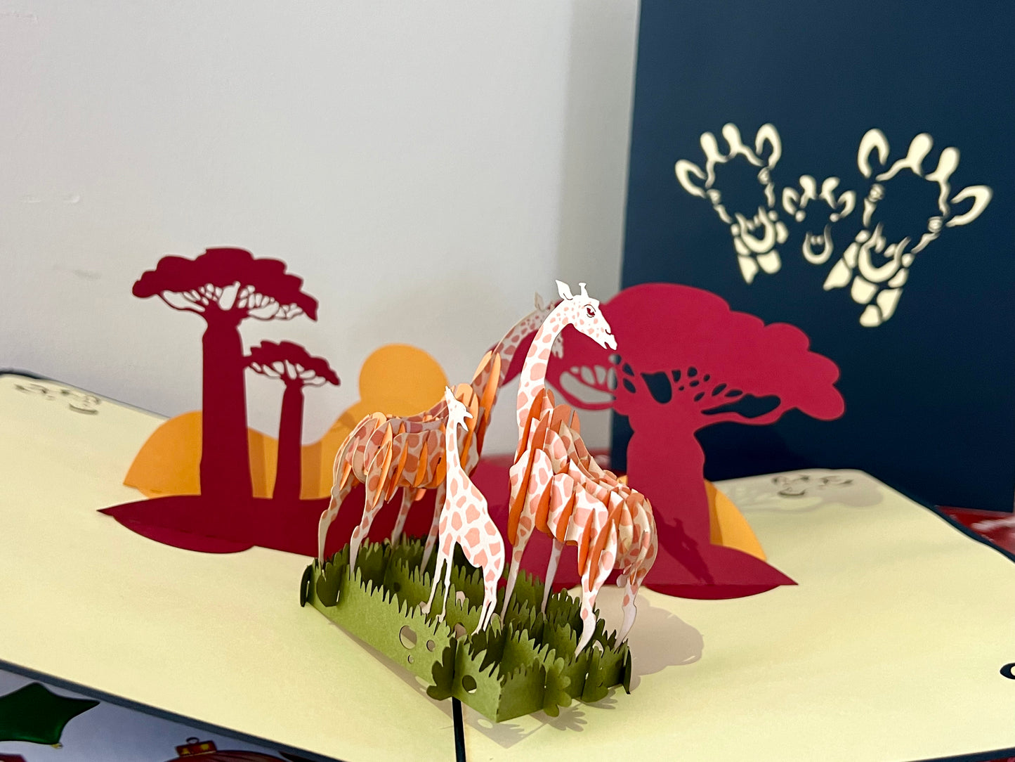 Giraffe family inside and outside