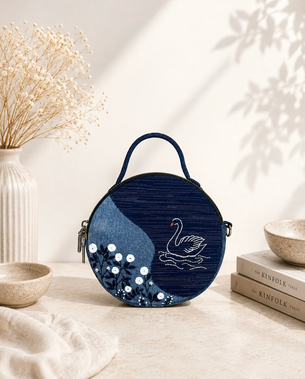 Upcycled denim handbag with hand-embroidered. 