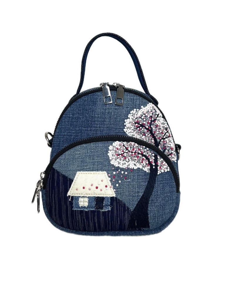 Unique handmade denim backpack with hand-embroidered blossom cottage 