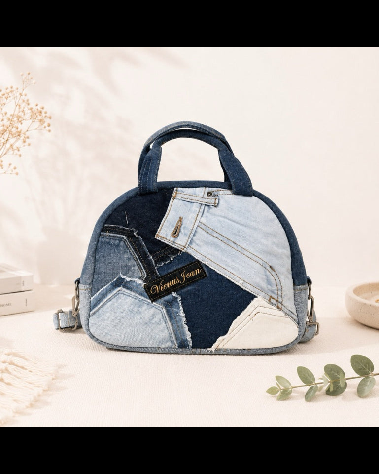 A dome-shaped handbag made from patchwork denim jeans pieces. Available online at Cuty
