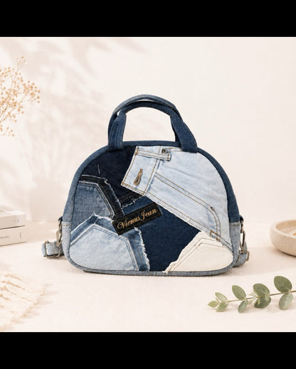 A dome-shaped handbag made from patchwork denim jeans pieces. Available online at Cuty