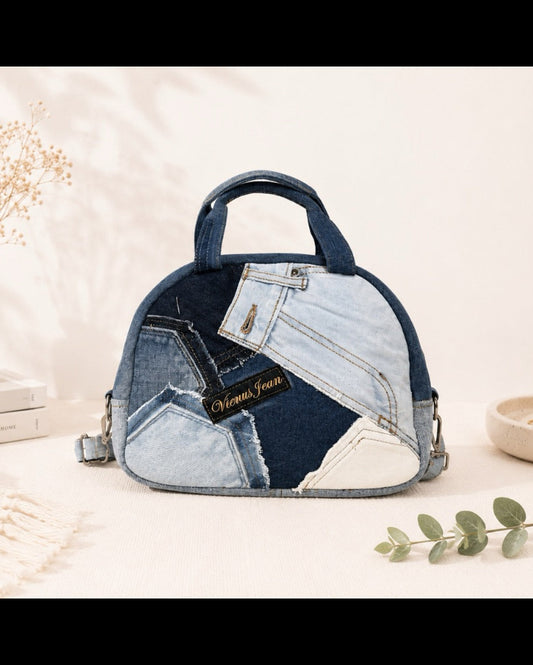 A dome-shaped handbag made from patchwork denim jeans pieces. Available online at Cuty