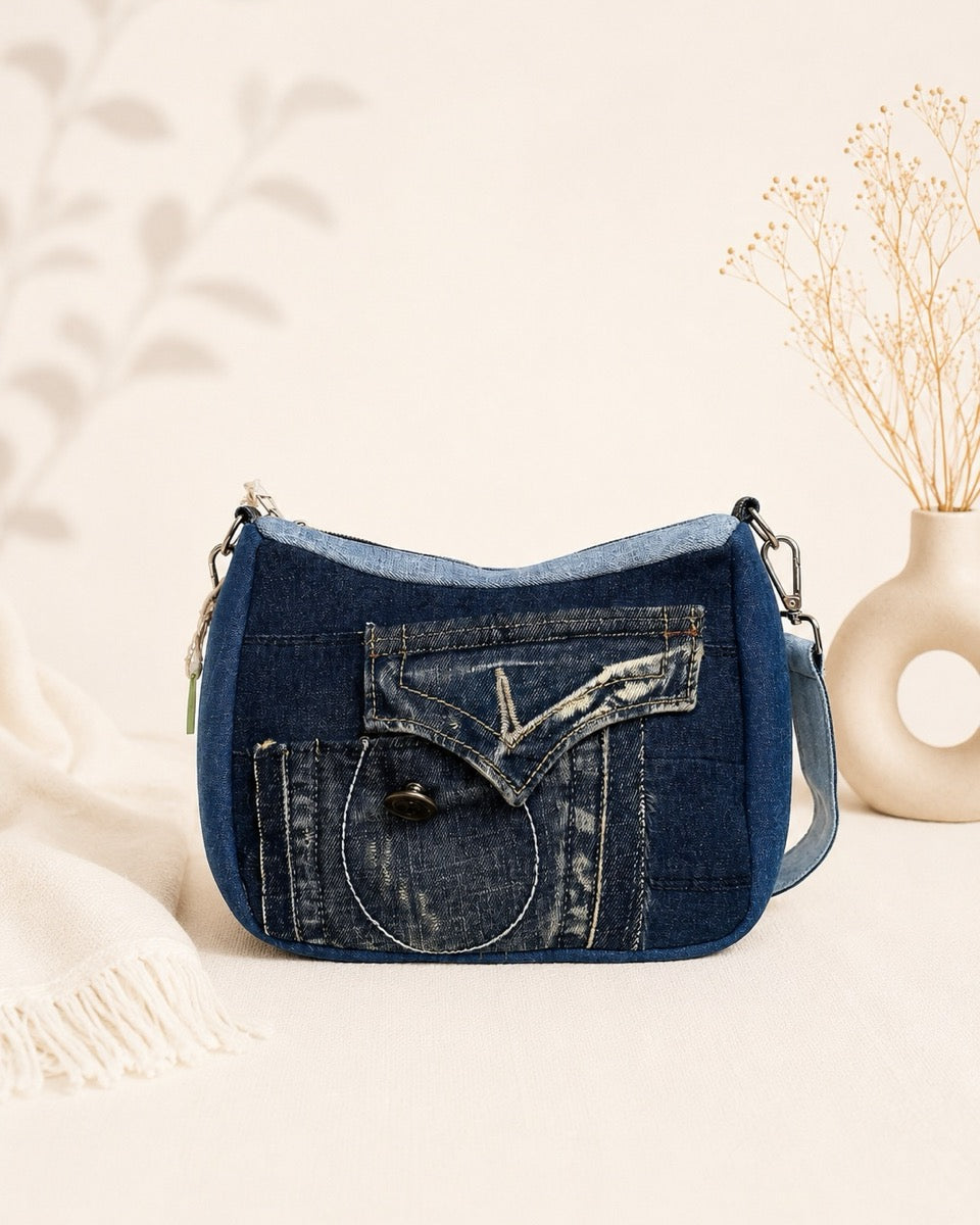 One-of-a-kind upcycled denim bag, features a short strap allows to wear as a shoulder bag or a handbag