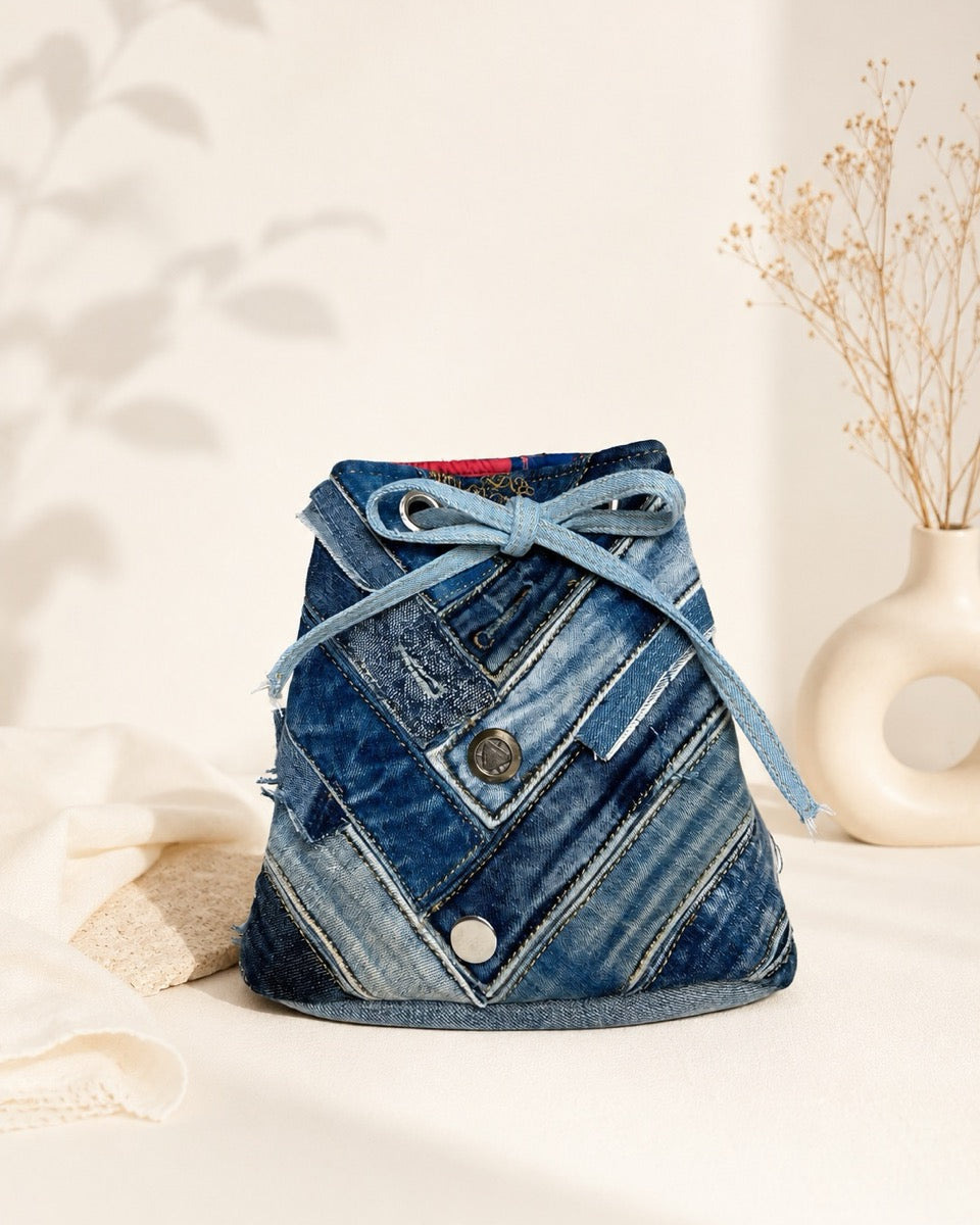 Handcrafted bucket bag made from preloved denim. Available at Cuty