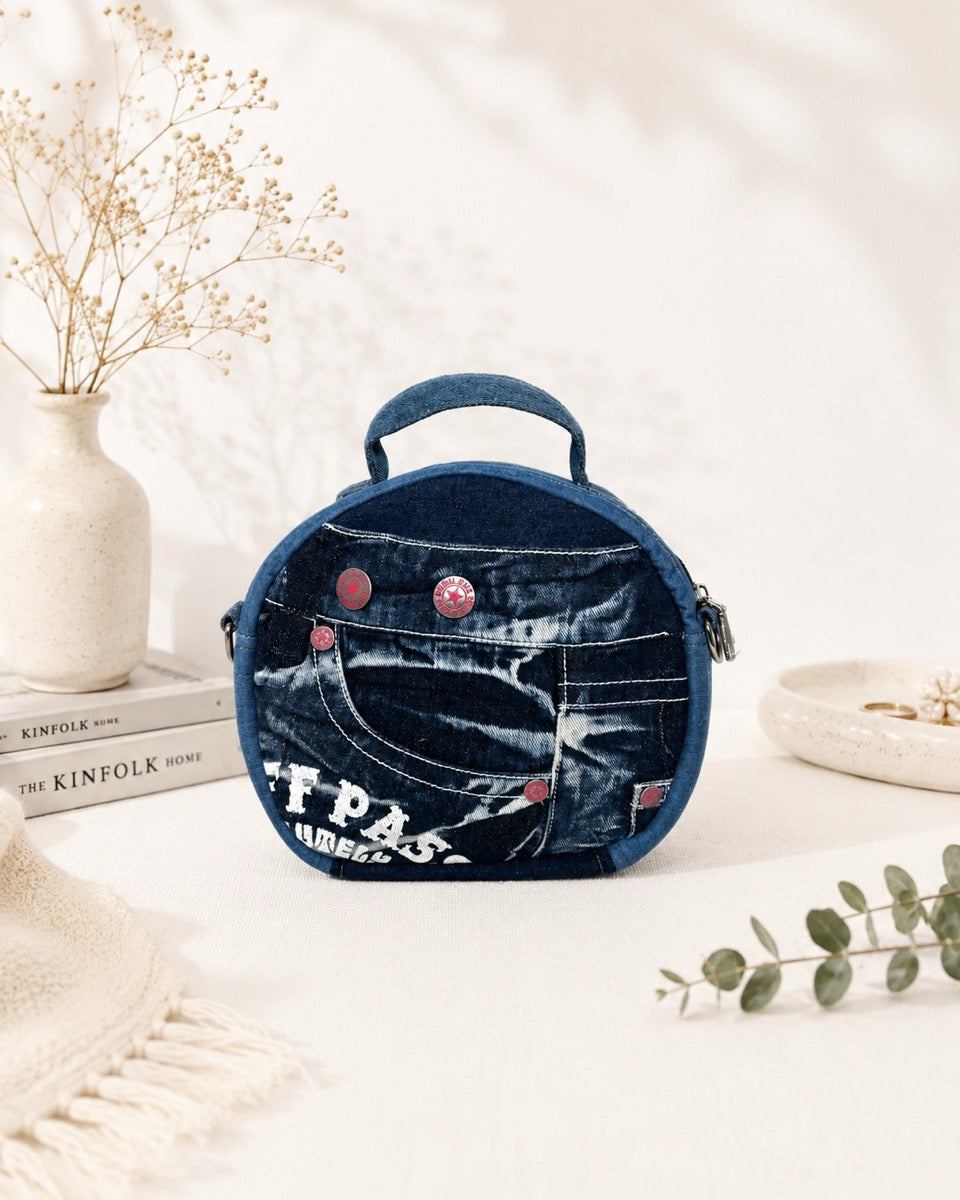 One-of-a-kind denim bag features red buttons, can wear as handbag or crossbody bag