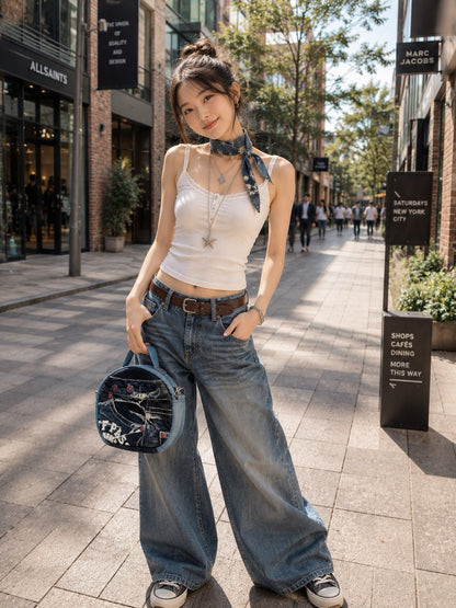 Unique denim handbag features a long, adjustable, and detachable allow to wear as a handbag or a crossbody bag