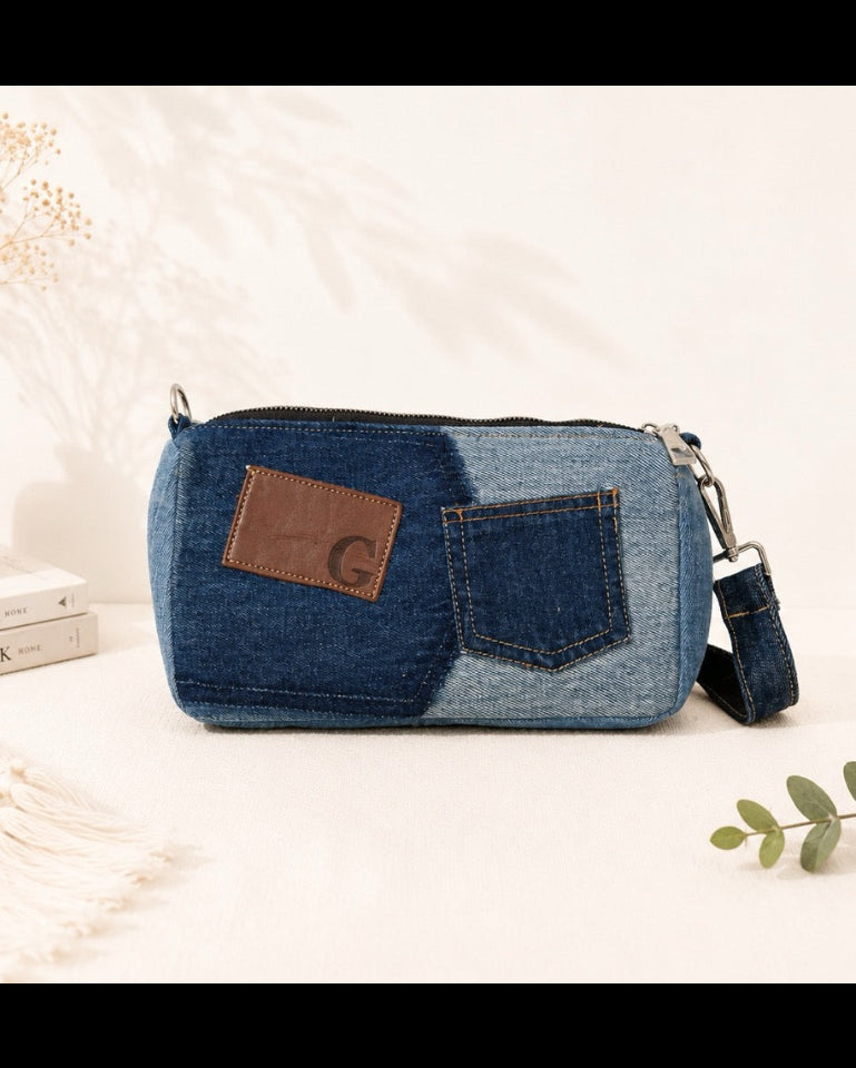 Unique upcycled denim bag with a short strap, can wear as shoulder bag or remove strap to wear as a handbag